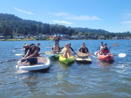 Group of people from Clean Power Research kayaking on Lake Sammamish