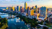 Austin, Texas skyline at sunset with reflections on Ladybird Lake