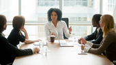 Female boss leading a team meeting