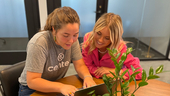 two Center team members working on a project together
