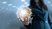 A business woman holding a globe of networking points.