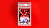 Photo of collectable baseball card featuring Shohei Ohtani, autographed, on a red background.