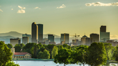 A photo of the Denver skyline is shown.
