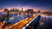 New York City at sunset from the Brooklyn Bridge.