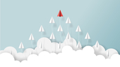 White paper airplanes follow a red paper airplane.