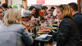 A group of coworkers enjoying a meal at a restaurant together.