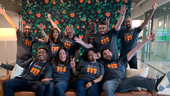 PagerDuty team members cheering with their arms in the air