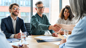 business people shaking hands at a meeting