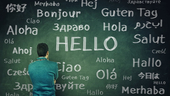 Man looking at different words that mean hello in many languages.