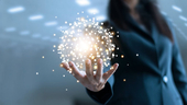 A business woman holding a globe of networking points.