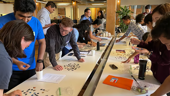 Cohere Health team members work on a group puzzle.