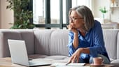 Woman at home having a video meeting on a laptop