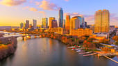Austin, Texas skyline at sunset with reflections on Ladybird Lake