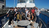 Leyton team photo on a boat
