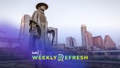 The Austin skyline behind a statue of Stevie Ray Vaughan