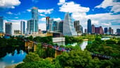 The Austin skyline surrounded by a river and forestry.