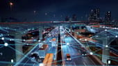 Photo of highway at night with overlay of logistical mapping of points
