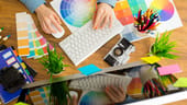 An image of a graphic designer at work is shown.