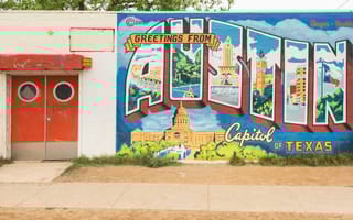 The Greetings from Austin mural, Inspired by a 1940s postcard, the vibrant mural depicts Austin landmarks like the Congress Avenue Bridge, The University of Texas Tower, and Barton Springs.