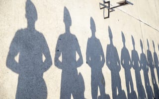 shadows of soldiers on wall