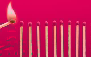 A line of matches, with another match moving toward a match at one end to light it.