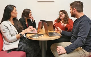 Matillion teammates discussing strategy in company office