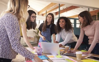 Image of five women coworkers collaborating