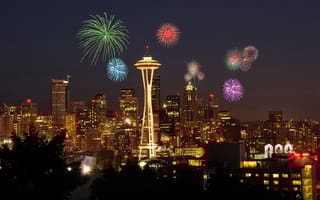 Downtown Seattle surrounded by fireworks.