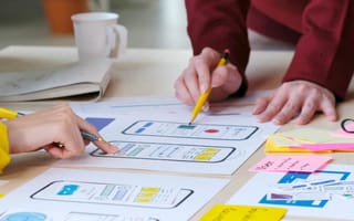 group of people working together on improving UX design