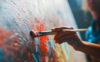 Woman artist works on abstract oil painting