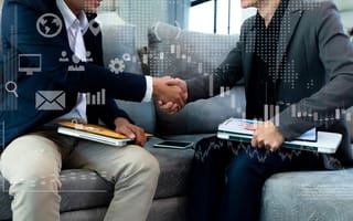 Business men shaking hands after a meeting
