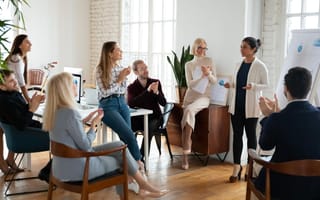 Female leader making a presentation to her colleagues