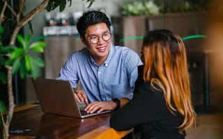 Business colleagues sitting in a trendy coworking space having a discussion