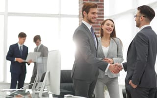Business people shaking hands after meeting