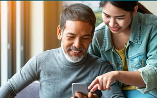 Man and woman looking at something on a mobile phone
