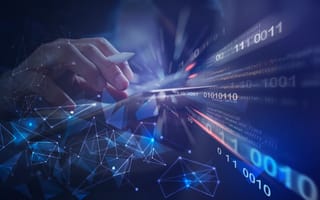 software developer working on digital tablet with binary, html computer code on virtual screen