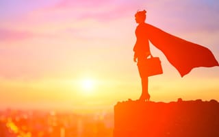 Superhero female figure standing on a ledge with a briefcase