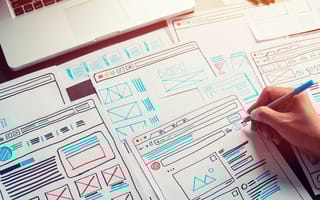 A website designer sketching a wireframe for a website
