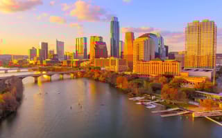 Austin, Texas skyline at sunset with reflections on Ladybird Lake
