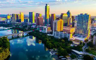 Austin, Texas skyline at sunset with reflections on Ladybird Lake
