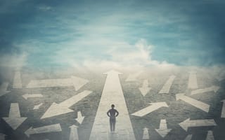 A silhouette of a jobseeker walking on a path with arrows pointing to different directions