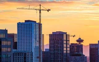 Sunset at Seattle skyline with construction cranes