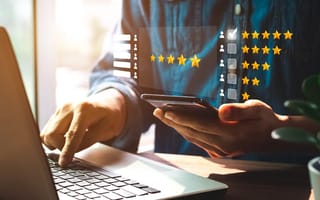 Person giving a star rating for service experience on online