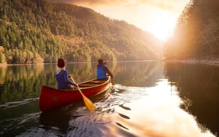Two people paddling a canoe
