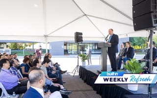 Gov. Jared Polis speaks at the opening of Atom Computing’s office in Boulder.
