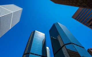 Looking straight up at rising Denver skyscrapers