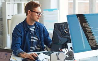 Software developer using computer in office