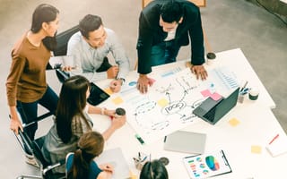 A product team draws out a product roadmap.