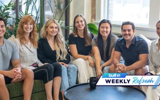 The Relevize team sits on a couch in an office.