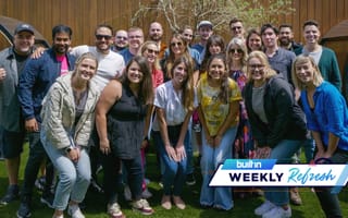 Teamwork’s Denver team smiles for a photo outside.